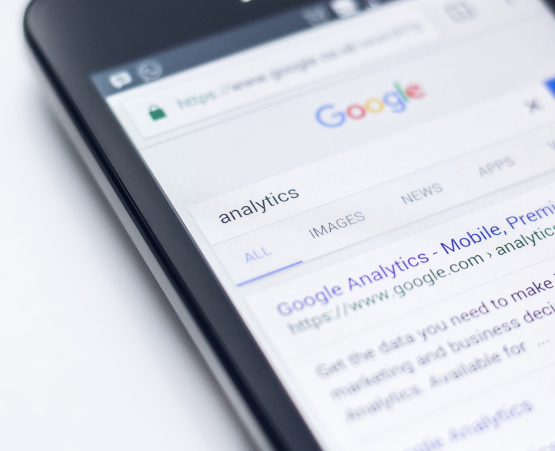 Phone showing results for analytics search on Google.